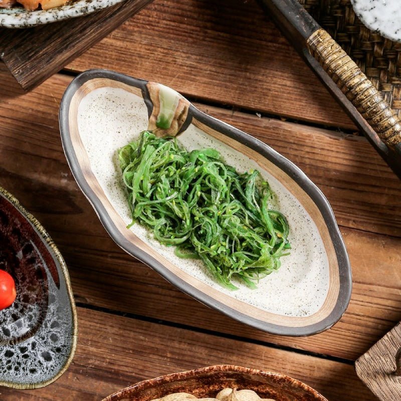 Hom & Ember – Elegant Shell-Shaped Serving Platters in Soft Tones for a Serene Dining Experience